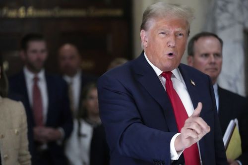 Former President Donald Trump speaks to reporters as he leaves the courtroom during a lunch break in his civil business fraud trial, Oct. 4, 2023, in New York. 