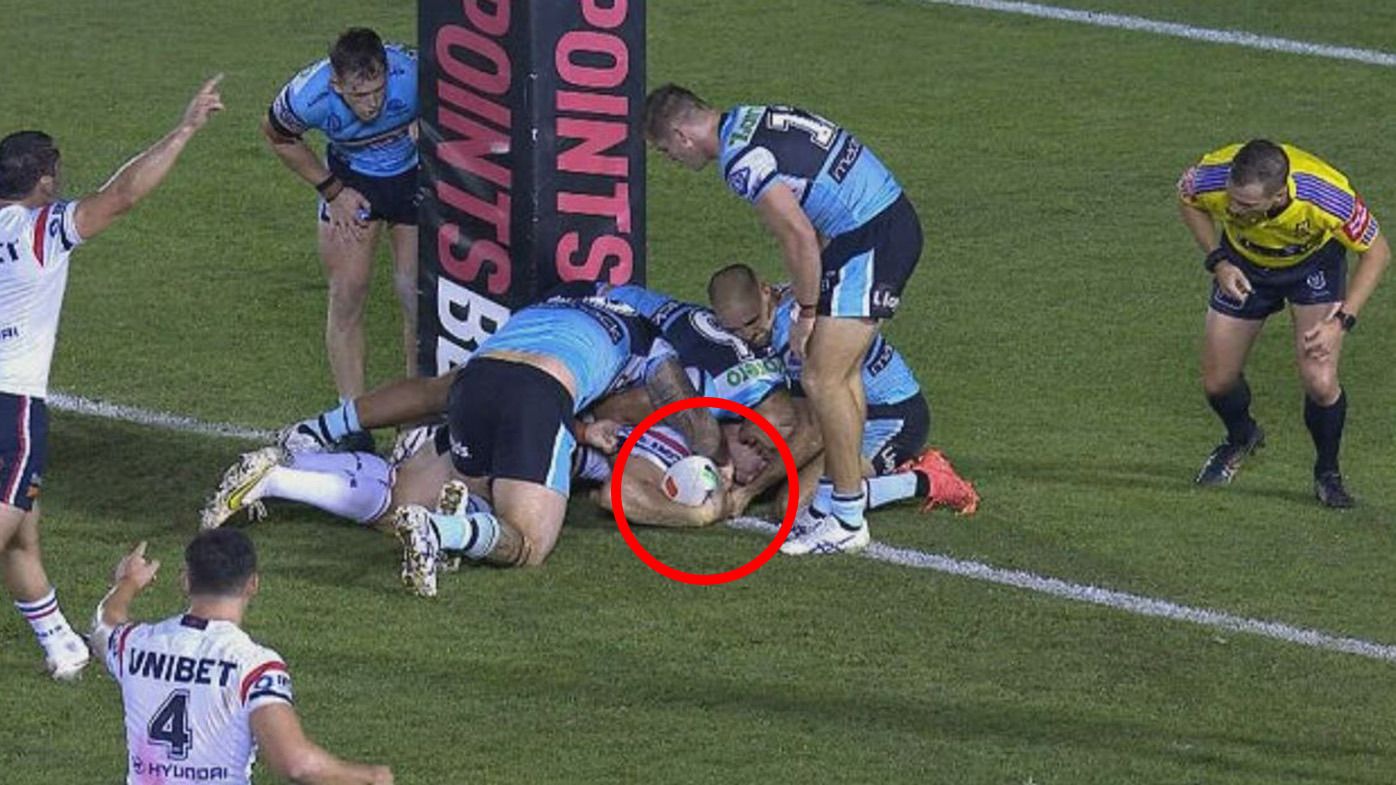 Lindsay Collins was deemed to have grounded this ball just short of the try line late in the Roosters loss to the Sharks.