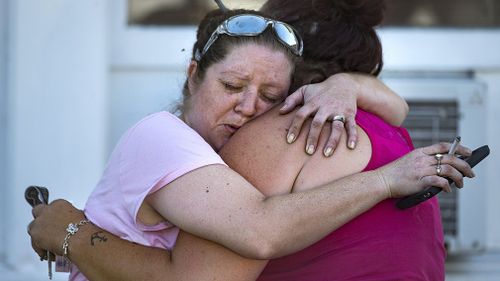 Family are awaiting news of their loved ones who were inside the church, which had a service scheduled for 11am. (AAP)