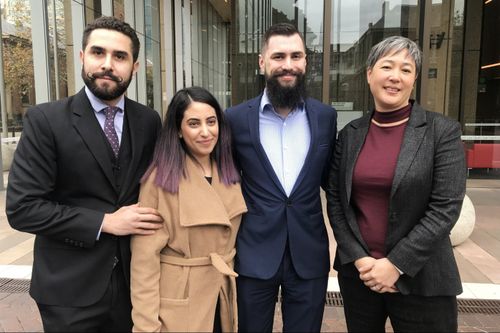 Plaintiffs Tom Raue (second right) and Elizabeth Mansour (second left) with lawyer Jahan Kalantar (left) and NSW Greens MP Jenny Leong (right) at the Supreme Court in Sydney, Friday, June 8, 2018. The plaintiffs are planning to file an injunction in the Supreme Court to stop a weekend NSW Police drug sniffer dog plan. (AAP)