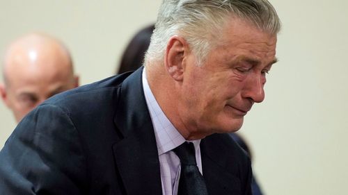 Alec Baldwin broke down in tears as the manslaughter case against him was dismissed.