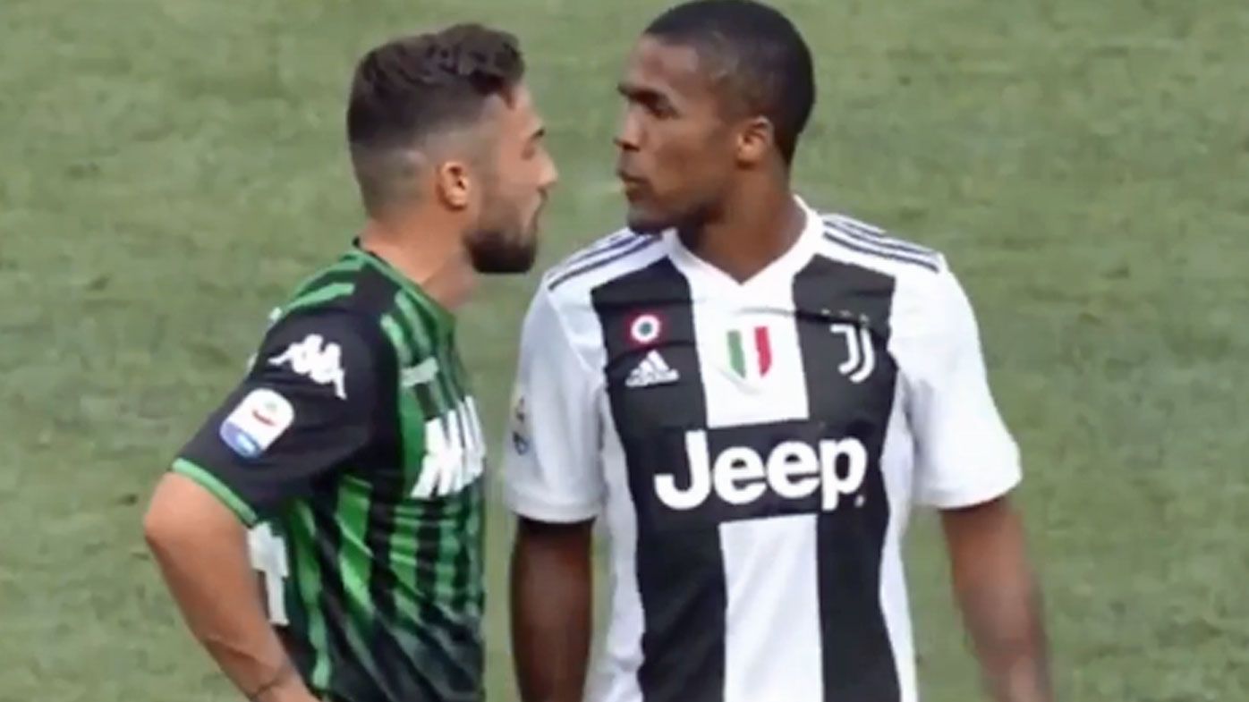 Juventus' Douglas Costa apologises for spitting in face of opponent