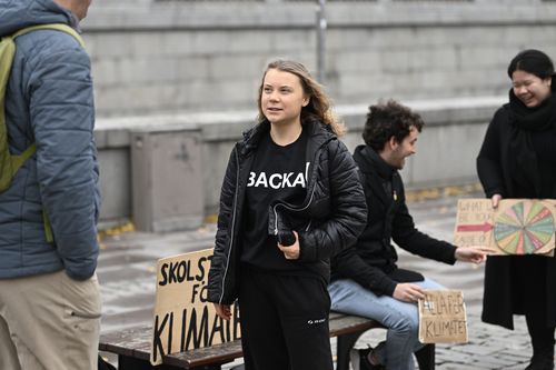 Climate activist Greta Thunberg arrives at the weekly Fridays for Future demonstration at the Mynttorget square next to the Swedish Parliament Riksdagen, in Stockholm, Sweden, on Nov. 11, 2022. 