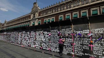 The names of murdered and missing women are written on a wall in Mexico City.
