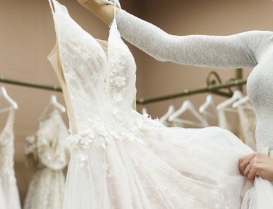 sisters looking at wedding dresses