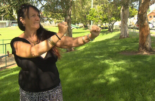 The woman admits to provoking her neighbours by singing loudly in the mornings. (9NEWS)