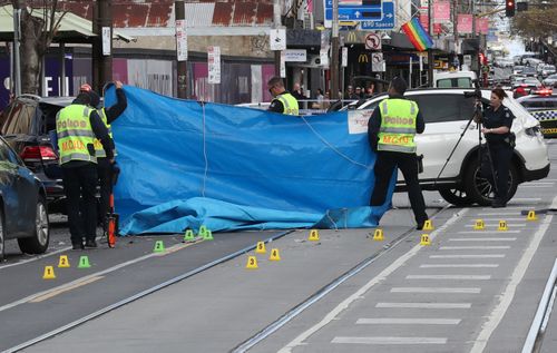 The 27-year-old cyclist was travelling in a bike lane in South Yarra's Chapel Street when she was struck by a white Mercedes-Benz and knocked into the path of another car on Sunday.
