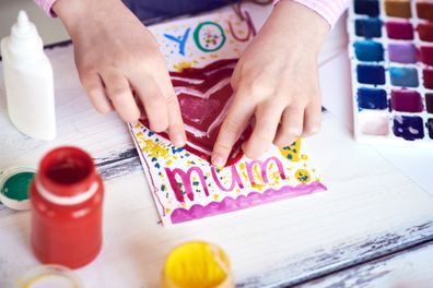 Girl making mother's day card