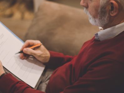 Older man writing his will