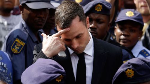 Pistorius leaving court after the first day of the sentence hearing. (AP Photo/Themba Hadebe)