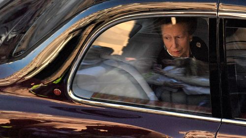 Britain's Princess Anne, Princess Royal looks from the window of a car following the hear carrying the coffin of Queen Elizabeth II, after leaving from St Giles' Cathedral on September 13, 2022 in Edinburgh, Scotland. 