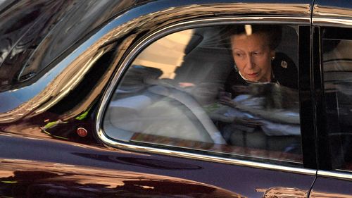 Britain's Princess Anne, Princess Royal looks from the window of a car following the hearse carrying the coffin of Queen Elizabeth II, after leaving from from St Giles' Cathedral on September 13, 2022 in Edinburgh, Scotland. 