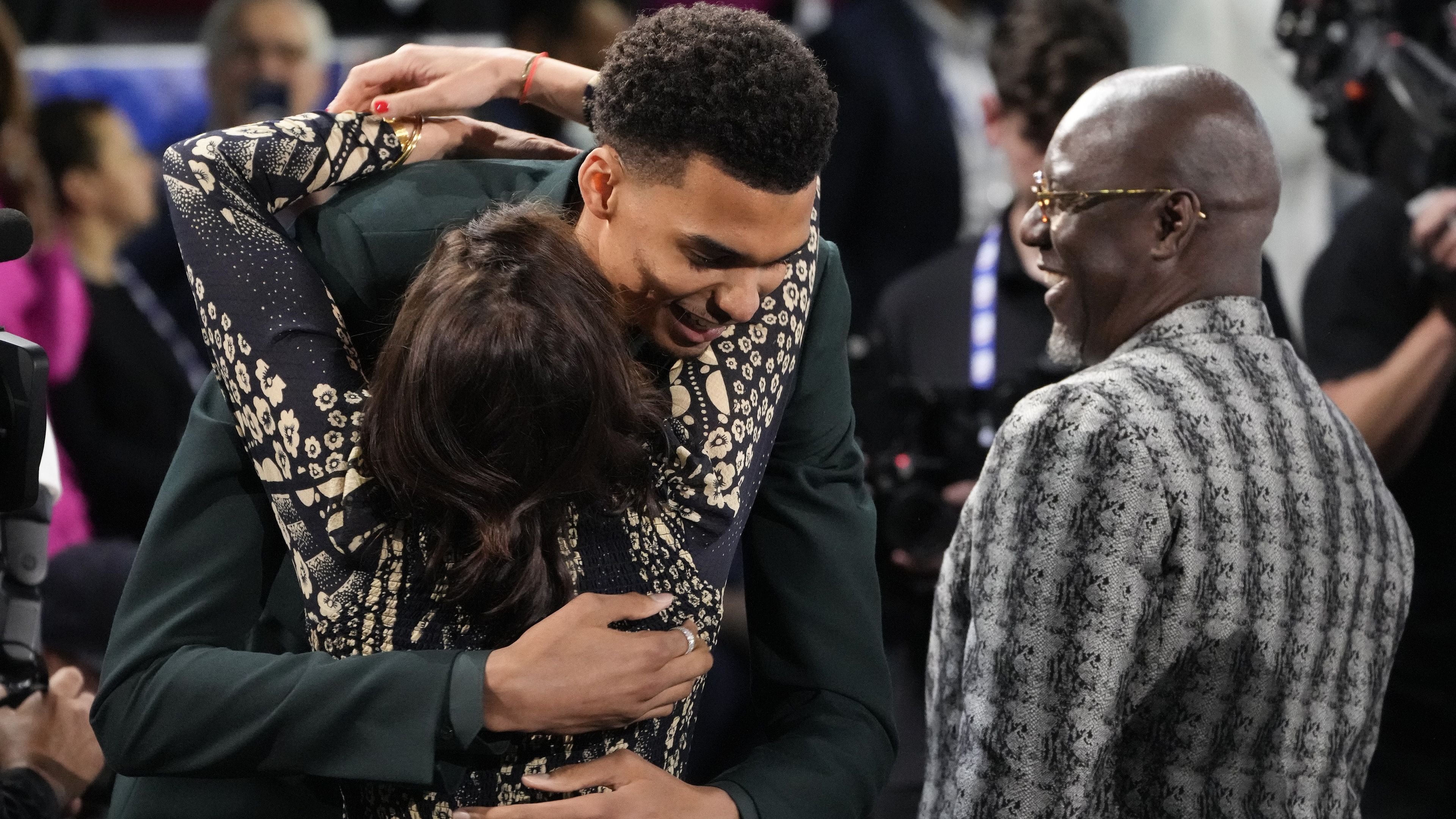 Victor Wembanyama hugs family and friends after being selected first overall by the San Antonio Spurs.