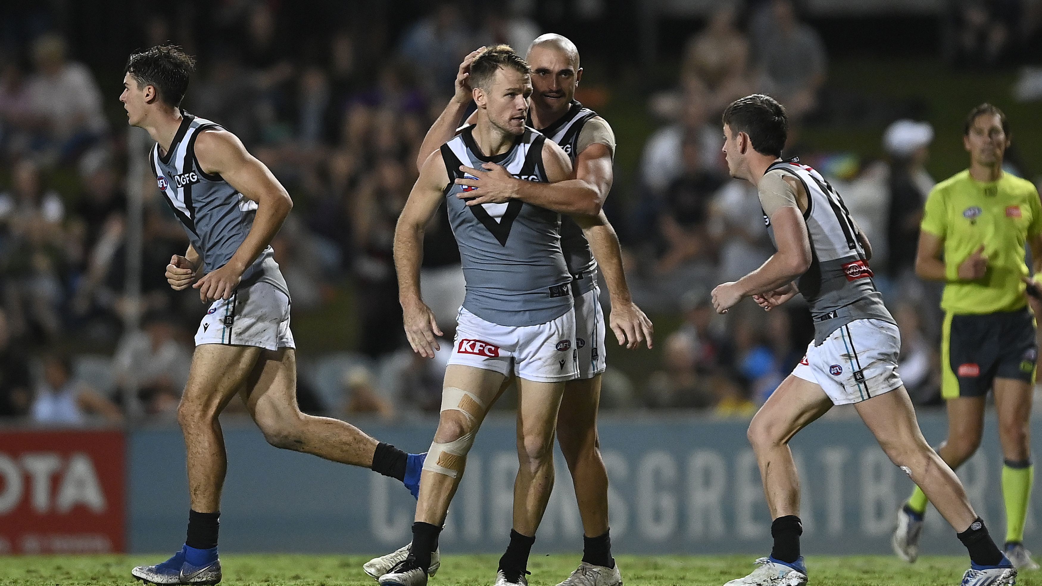 The Power&#x27;s Robbie Gray celebrates with teammates after kicking a goal.