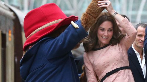 The Duchess of Cambridge has a dance with Paddington Bear. (AAP)
