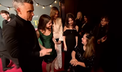 Teddy attended the premiere with her father and her mother, Ayda Field, and greeted a fan, Connie on the carpet, who also starred in the film as an extra. 