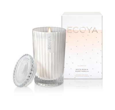 <a href="https://www.ecoya.com/ecoya/shop/Shop+by+Collection/Celebration/White+Musk++Warm+Vanilla++Celebration+Candle+Jar.html#.WJp6L1V95aQ" target="_blank">Ecoya Celebration Collection Candle in White Musk and Vanilla, $39.95.</a>