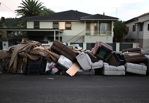 Discarded furniture outside a flood affected property on March 02, 2022 in Lismore, Australia. Several northern New South Wales towns have been forced to evacuate as Australia faces unprecedented storms and the worst flooding in a decade. (Photo by Dan Peled/Getty Images)