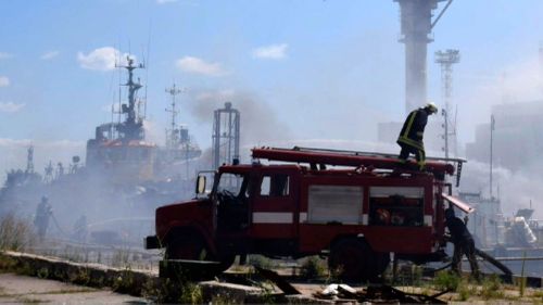 Firefighters put out a fire in the port after a Russian missiles attack in Odesa