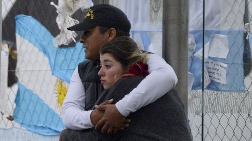 Relatives embraced after the announcement on Thursday at the submarine's home naval base. (AAP)