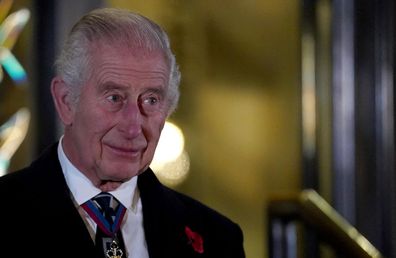 Britain's King Charles reacts after unveiling statues of Britain's Queen Elizabeth and Prince Phillip upon his and Queen Camilla arrival to attend the Royal British Legion Festival of Remembrance at the Royal Albert Hall in London, Britain, November 11, 2023. REUTERS/Maja Smiejkowska/Pool