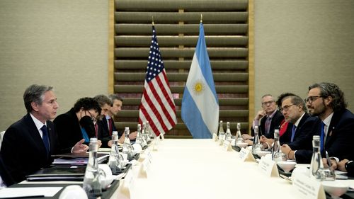 US Secretary of State Antony Blinken, left, meets with Argentine Foreign Minister Santiago Cafiero, right, during the G-20 Foreign Ministers Summit in Nusa Dua, on Indonesia's resort island of Bali Friday, July 8, 2022. (Stefani Reynolds/Pool Photo via AP)