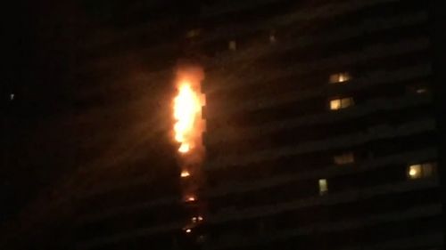 Flames seen billowing out of the Spencer street apartment.