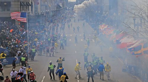 Smoke fills the street after a second explosion went off near the finish line of the Boston Marathon. (Getty)