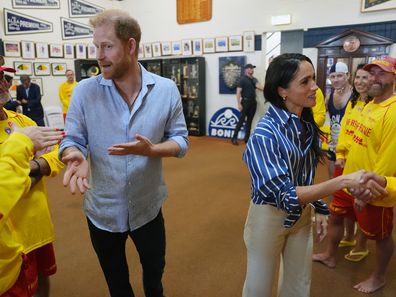 Meghan, Duchess of Sussex and Prince Harry, Duke of Sussex pose for a selfie photo as they meet volunteer first responders from Bondi Surf Bathers' Life Saving Club, during a visit to Bondi Beach, on day four of the royal trip to Australia on April 17, 2026 in Sydney, Australia. 