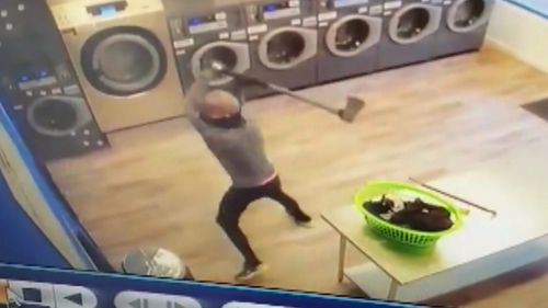 An axe-wielding thief has robbed an Adelaide laundromat.