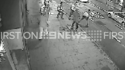 The fight turns dangerous as it spills onto a busy road. (9NEWS)