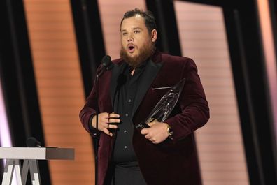 Luke Combs accepts the award for entertainer of the year at the 55th annual CMA Awards on Wednesday, November 10, 2021, at the Bridgestone Arena in Nashville