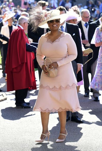 <strong>Photo of Oprah Winfrey</strong> in a blush dress and matching hat arriving at Meghan Markle and Prince Harry's wedding