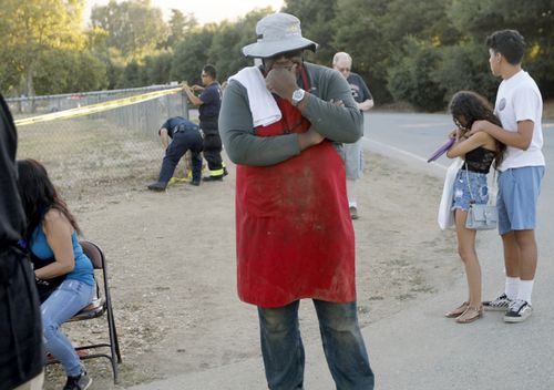 People leave the Gilroy Garlic Festival following a shooting in Gilroy.