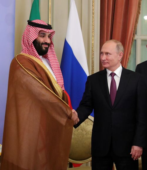 Saudi's Crown Prince, accused of the murder of journalist Jamal Khashoggi, is all smiles as he shakes hands with President Putin.