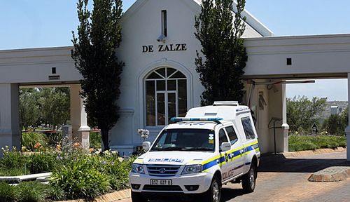 A police vehicle outside the exclusive gated housing estate near Cape Town where the van Breda family lived. (Photo: AP).