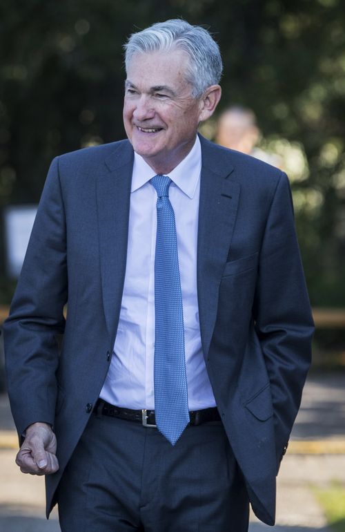 Federal Reserve Chair Jerome Powell smiles and walks after his speech at the central bank's annual symposium at Jackson Lake Lodge in Grand Teton National Park Friday, Aug. 26, 2022. in Moran, Wyo. (AP Photo/Amber Baesler)