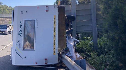 An elderly couple's caravan crashed on the M1 in Sydney this morning.