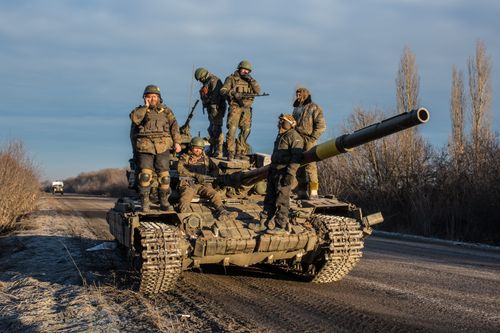 Ukrainian soldiers who left Debaltseve yesterday prepare to return to support the further withdrawal of troops on February 19, 2015 in Artemivsk, Ukraine