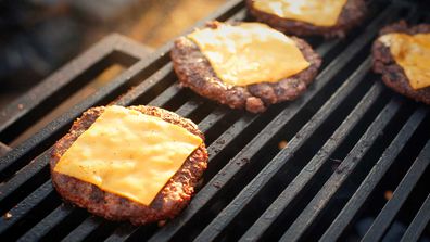 Grilling burger patties with cheese