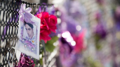 Fans of US musician Prince still leave notes and flowers on a fence outside of Paisley Park, Princes' home and where he was found dead after an overdose in two years ago Chanhassen, Minnesota. (EPA)