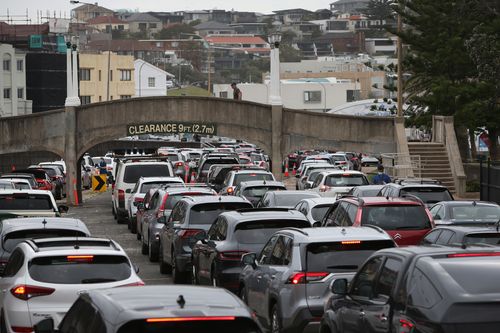 People queue at the Bondi Beach COVID-19 drive through testing clinic in December, 2021