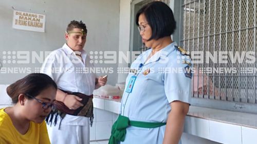 9News obtained images of Lawrence farewelling guards in a Hindu ceremony at a temple inside her Bangli prison.