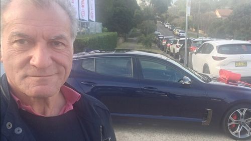 Victor took a selfie with his new car - and found out later he'd been hit with the parking fine.