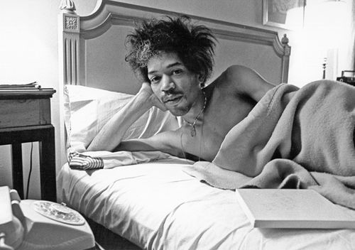 Rock and roll star Jimi Hendrix in bed at the Drake Hotel in New York, New York in 1968. (Photo by Roz Kelly/Michael Ochs Archives/Getty Images)