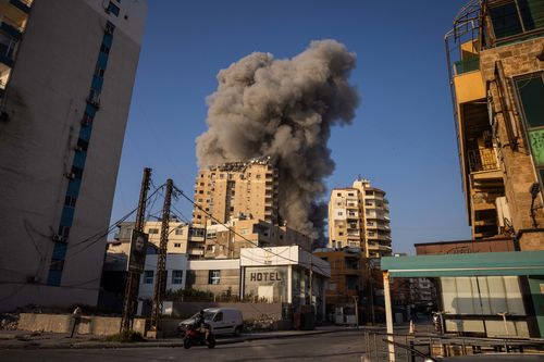 Smoke rises after an Israeli airstrike on November 1, 2024 in Tyre, Lebanon. In recent weeks, Israeli airstrikes have become more frequent in this southern Lebanese city, which was previously a refuge for displaced people from areas farther south near the border with Israel. In some instances, the Israeli army has issued evacuation orders for parts of the city prior to bombing. (Photo by Ed Ram/Getty Images)