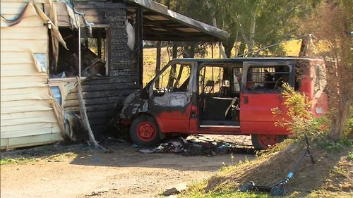 The van was engulfed in flames following the crash.