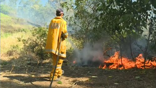 Firefighters in Queensland are working to combat the 122 blazes still burning across the state, like this fire at North Deep Creek near Gympie.