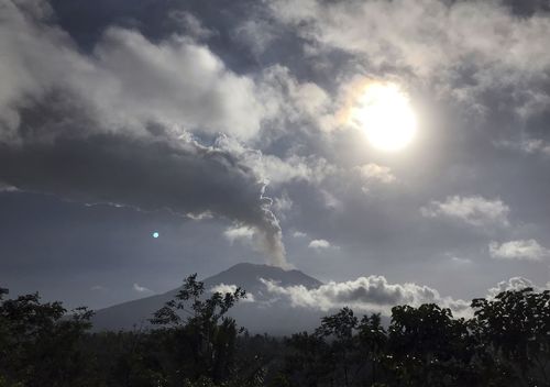 The eruption sprayed ash more than two kilometres into the air, affecting travel into and out of Bali. Picture: AAP.