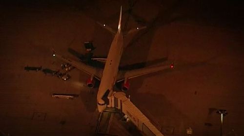 The process began with Corby switching flights from Bali at the last moment and rushed through Brisbane Airport while other passengers were held back. Picture: 9NEWS.